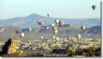 Hot air balloons crowd the sky above Cappadocia, Turkey