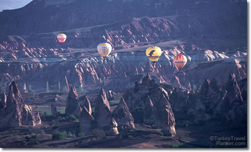 Hot Air Balloons Flying over the moonscape of Cappadocia, Turkey