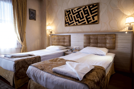 Hotel Tashkoak & Suites Beds