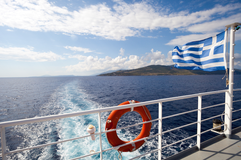 Ferry boat in Greece view on sea and islands with cruise ship trail