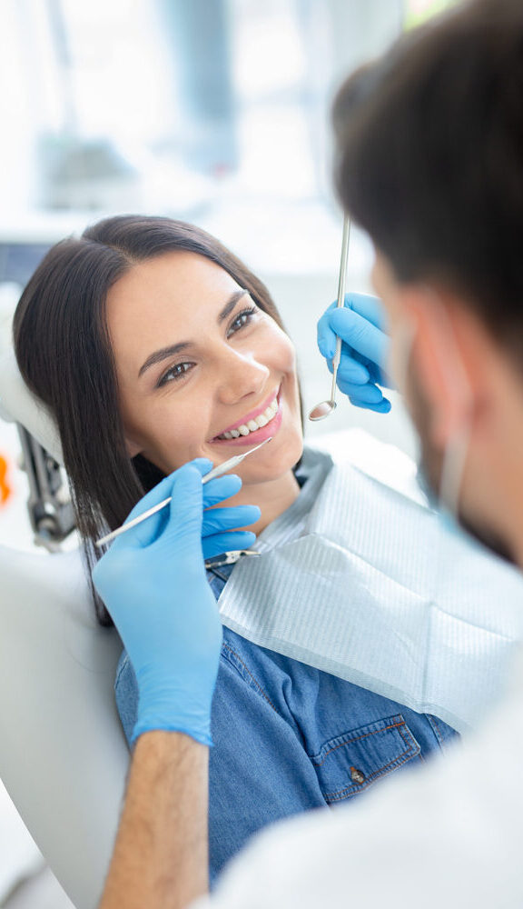 Smiling,Female,Patient,At,Dental,Procedure,In,Modern,Dental,Clinic