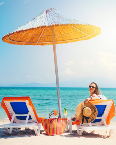 Beautiful,Woman,Lying,On,Sunbed,On,Golden,Beach